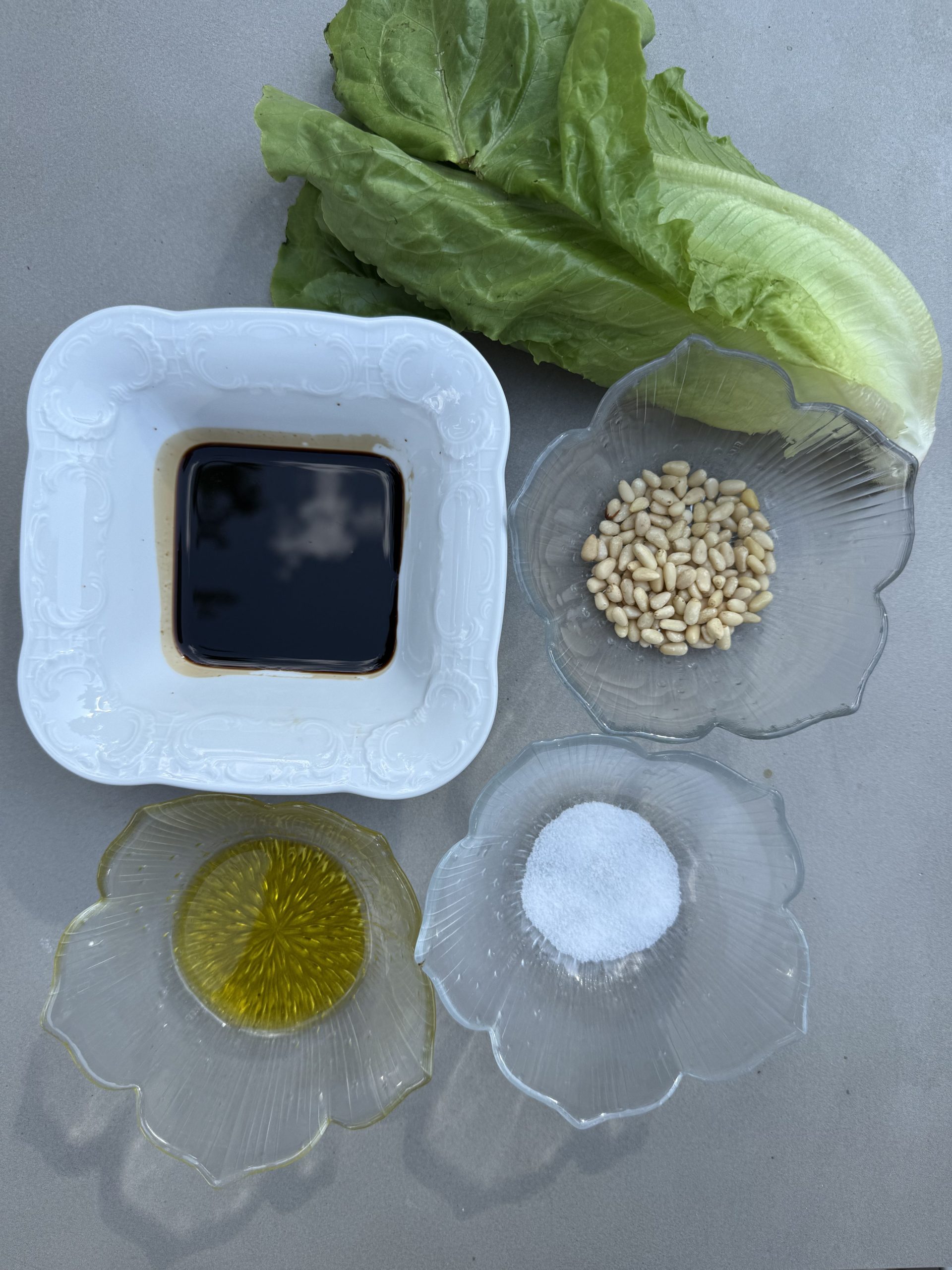 grilled Romano lettuce with pine tree nuts